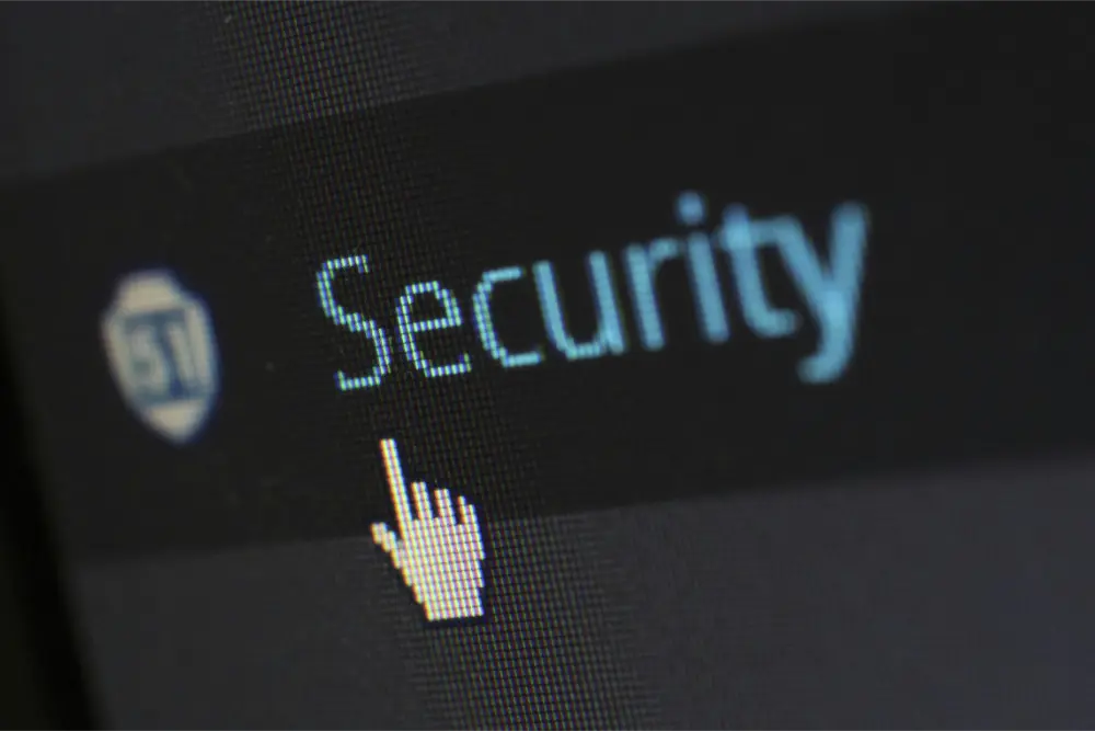A computer screen displays the word "Security" with a cursor hand pointing to it, highlighting MSP solutions and a focus on online safety or cybersecurity.