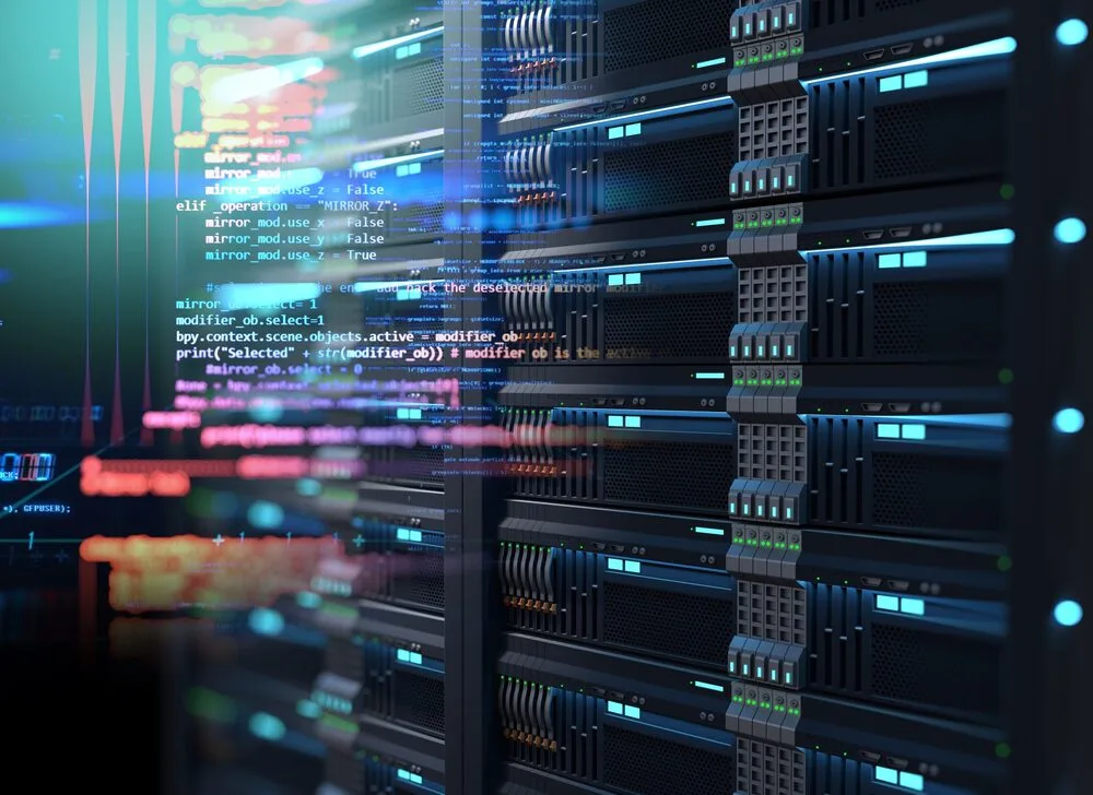 A close-up of server racks in a data center with colorful, semi-transparent lines of code overlaying the image.