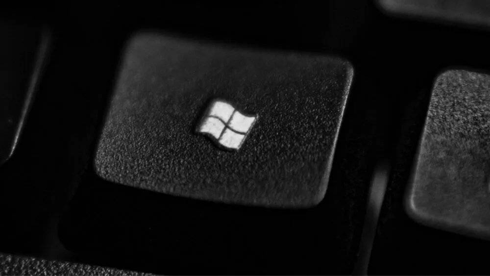 Close-up of a black keyboard key with the Microsoft Windows logo on it.