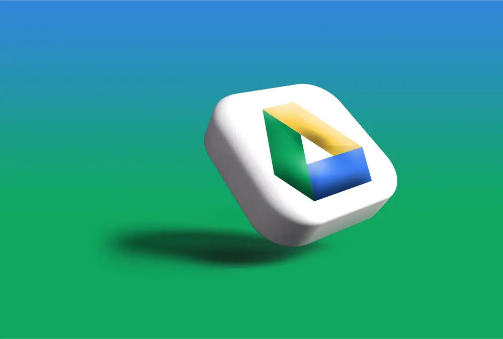 A 3D button featuring the Google Drive logo floats above a green and blue gradient background, casting a shadow below it.