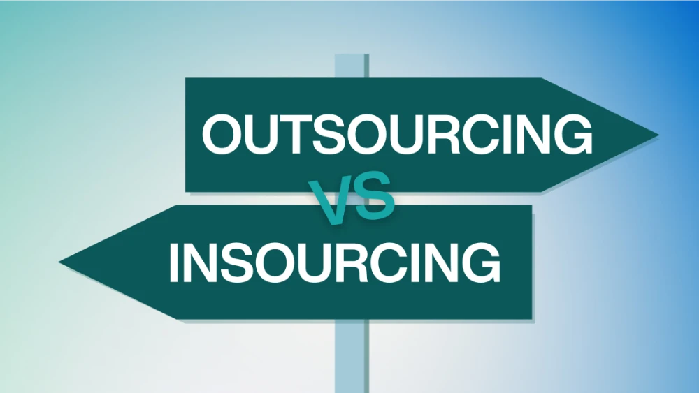 Insourcing vs Outsourcing Two directional signboards pointing opposite ways, one labeled "Outsourcing" and the other "Insourcing," with "VS" in the center. The background fades from light blue to white.