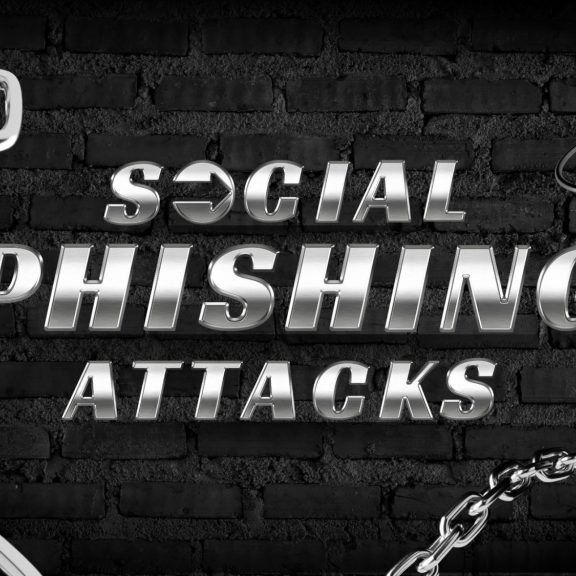 Text reads “Social Phishing Attacks” in large metallic letters against a dark brick wall background.
