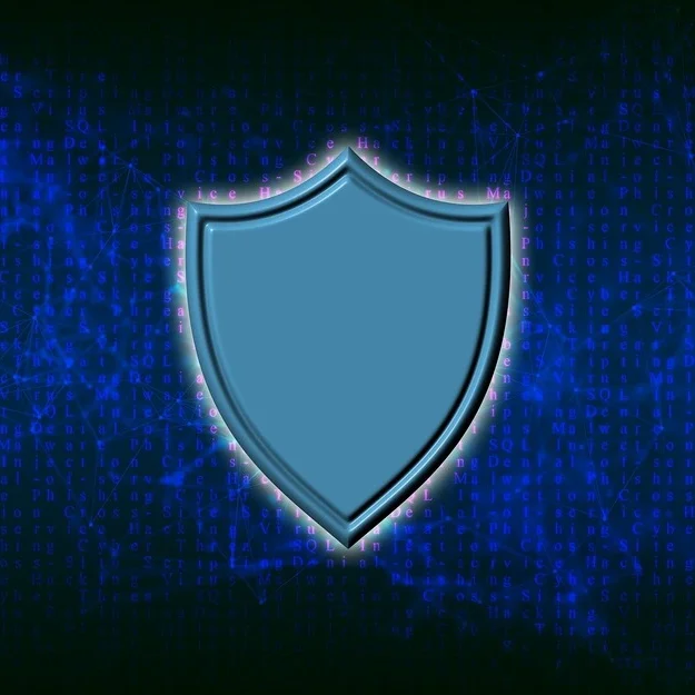 A blue shield icon is centered against a dark background filled with lines of code and network patterns, representing cybersecurity and data protection.